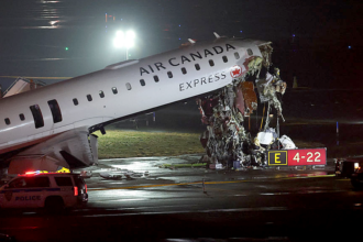 Air Canada jet hits fire truck, killing 2 and forcing New York's LaGuardia airport to close