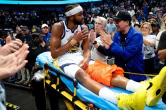 Warriors' Moses Moody leaves game on stretcher after suffering gruesome injury on dunk attempt