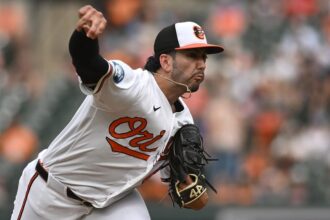 Orioles pitcher takes part in gender reveal as he walks off mound following relief appearance
