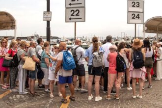 Stunning vacation hot spot turns into overcrowded nightmare as tourists flood streets