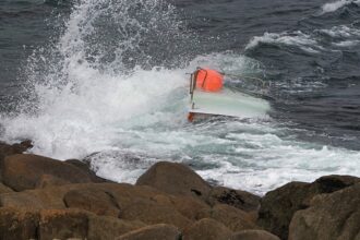 Teen boater found clinging to capsized vessel after 3 go missing; 2 bodies recovered